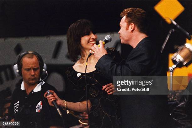 June 11: Ali Campbell of UB40 is joined on stage by Chrissie Hynde of The Pretenders to perform at the Nelson Mandela 70th Birthday Tribute concert...