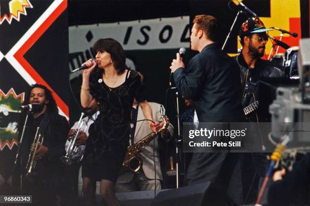 June 11: Ali Campbell of UB40 is joined on stage by Chrissie Hynde of The Pretenders to perform at the Nelson Mandela 70th Birthday Tribute concert,...