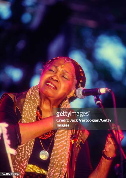 American folk singer Odetta performs folk songs and the blues at the Bell Atlantic Jazz Festival at Rumsey Playfield in Central Park, New York, New...