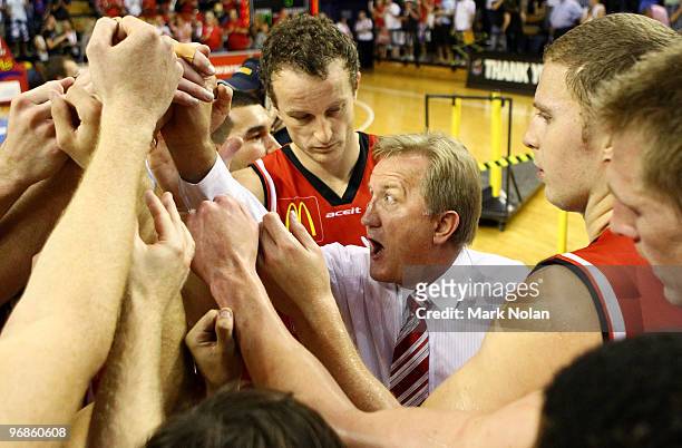 Hawks coach Gordie McLeod celebrates with his team after game one of the NBL semi final series between the Wollongong Hawks and the Townsville...