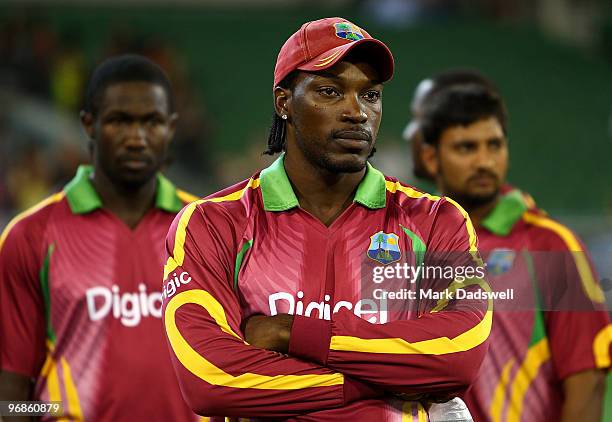 Captain of the West Indies Chris Gayle watches the presentations after Australia won the Fifth One Day International match between Australia and the...