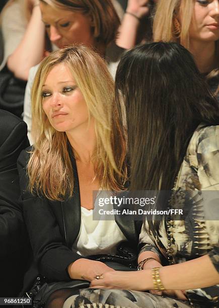 Kate Moss is consoled by Annabelle Neilson while attending Naomi Campbell's Fashion For Relief Haiti London 2010 Fashion Show at Somerset House on...