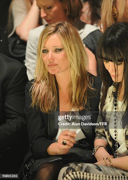 Kate Moss is consoled by Annabelle Neilson while attending Naomi Campbell's Fashion For Relief Haiti London 2010 Fashion Show at Somerset House on...