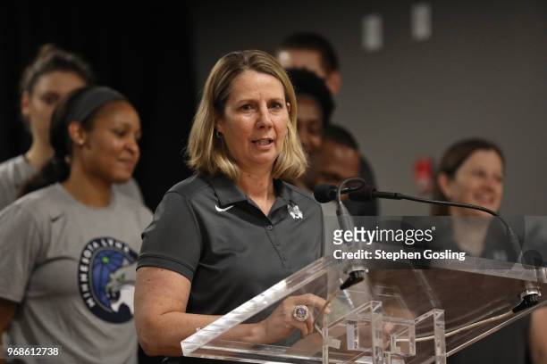 Cheryl Reeve of the Minnesota Lynx speaks during a press conference after a community event giving away shoes and socks at Payne Elementary in...