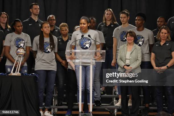 Maya Moore of the Minnesota Lynx speaks during a press conference after a community event giving away shoes and socks at Payne Elementary in...