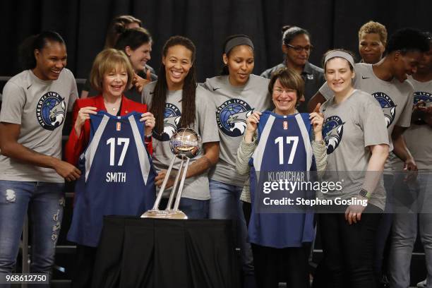 Senators, Amy Klobuchar and Tina Smith pose for a photo with the Minnesota Lynx during a press conference after a community event giving away shoes...
