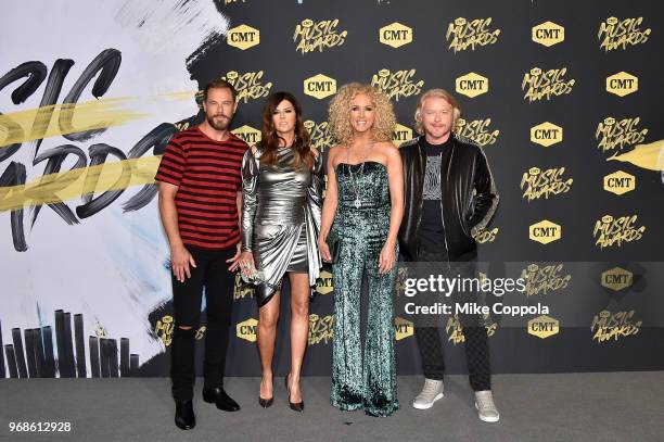 Jimi Westbrook, Karen Fairchild, Kimberly Schlapman and Philip Sweet of musical group Little Big Town attends the 2018 CMT Music Awards at...