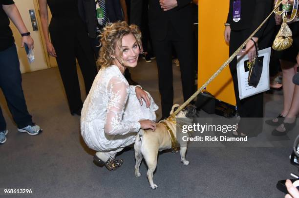 Clare Bowen and Doug the Pug attend the 2018 CMT Music Awards at Bridgestone Arena on June 6, 2018 in Nashville, Tennessee.