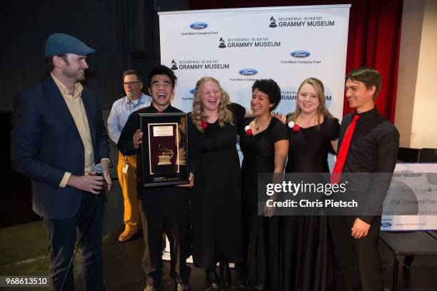 The GRAMMY Museum's Patrick Lundquist presents North Eugene High students Patrick Feng , Tasia Rusco, Janely Becerra, Kaitlyn Whittlesey and Ryan...