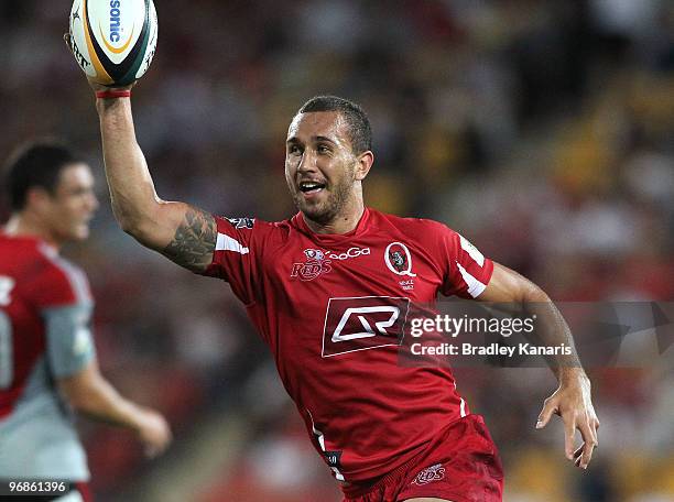 Quade Cooper of the Reds celebrates as he crosses over for a try during the round two Super 14 match between the Reds and the Crusaders at Suncorp...