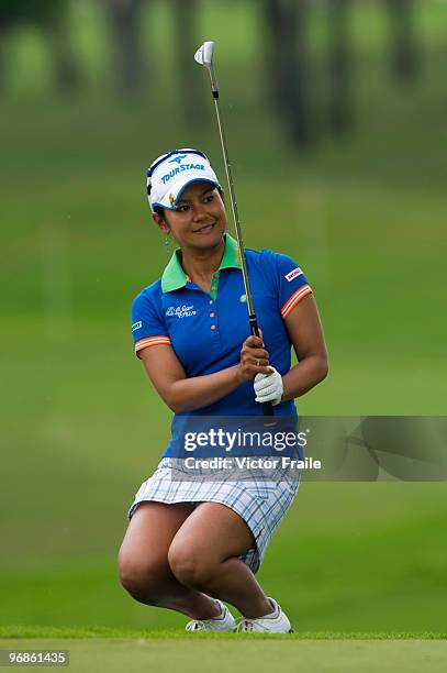 Ai Miyazato of Japan chips onto the 10th green during round two of the Honda LPGA Thailand at the Siam Country Club on February 19, 2010 in Chon...