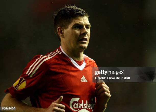 Steven Gerrard of Liverpool in action showing the Europa League badge on his sleeve during the UEFA Europa League Round 32 first leg match between...