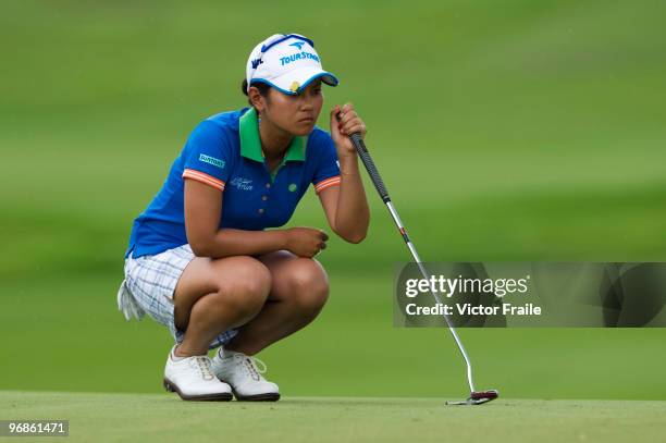 Ai Miyazato of Japan lines up a putt on the 10th green during round two of the Honda LPGA Thailand at the Siam Country Club on February 19, 2010 in...