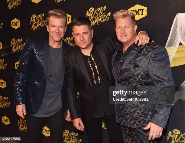 Joe Don Rooney, Jay DeMarcus and Gary LeVox of musical group Rascal Flatts attend the 2018 CMT Music Awards at Nashville Municipal Auditorium on June...