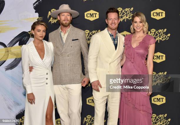 Brittney Marie Kelley, Brian Kelley and Tyler Hubbard of Florida Georgia Line, and Hayley Hubbard attend the 2018 CMT Music Awards at Bridgestone...