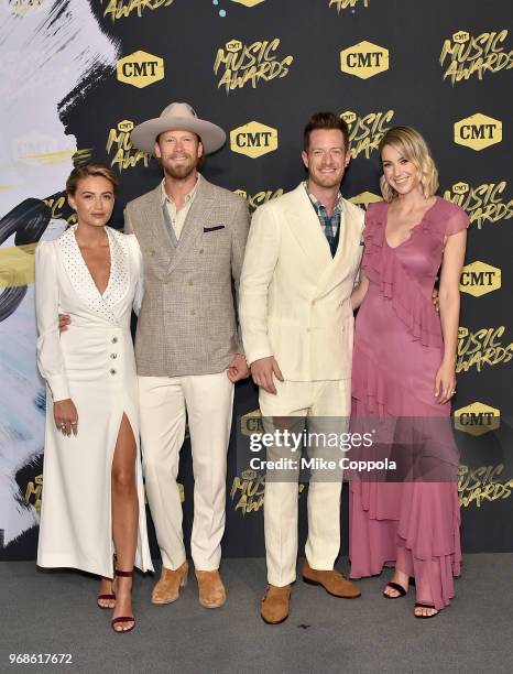 Brittney Marie Kelley, Brian Kelley and Tyler Hubbard of Florida Georgia Line, and Hayley Hubbard attend the 2018 CMT Music Awards at Bridgestone...