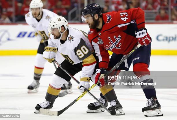 Tomas Tatar of the Vegas Golden Knights plays against the Tom Wilson of the Washington Capitals during Game Four of the 2018 NHL Stanley Cup Final at...