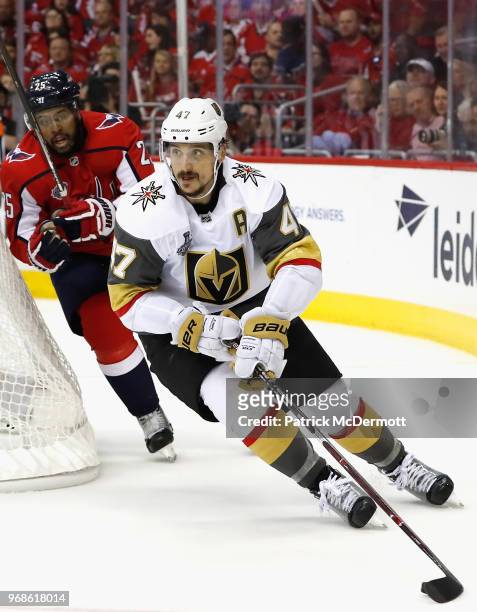 Luca Sbisa of the Vegas Golden Knights is chased by Devante Smith-Pelly of the Washington Capitals during Game Four of the 2018 NHL Stanley Cup Final...