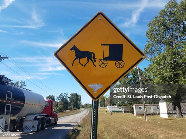 Sign on Shafer Road near Licking, Mo., warns drivers about Amish buggies. Licking is a new Amish settlement where two people have died since 2014...