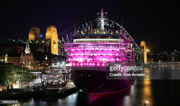Cunard cruise ship the Queen Victoria is illuminated in pink to raise awareness for breast cancer research in Sydney Harbour on February 19, 2010 in...