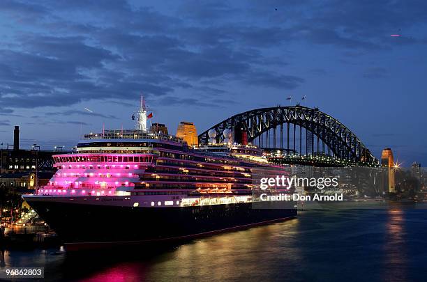 Cunard cruise ship the Queen Victoria is illuminated in pink to raise awareness for breast cancer research in Sydney Harbour on February 19, 2010 in...