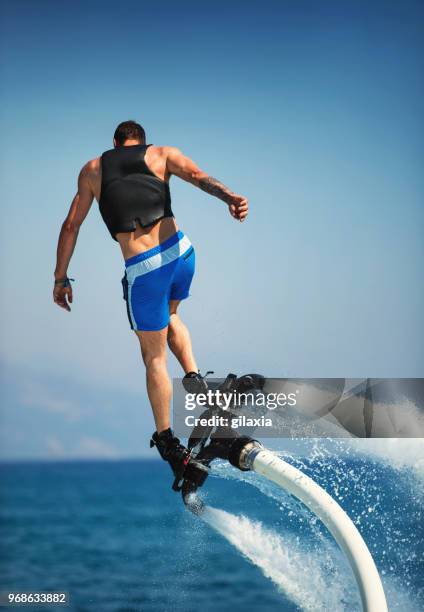 flyboard. - raketentriebwerk stock-fotos und bilder