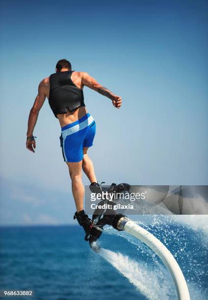 flyboarding. - hoverboard water stock pictures, royalty-free photos & images