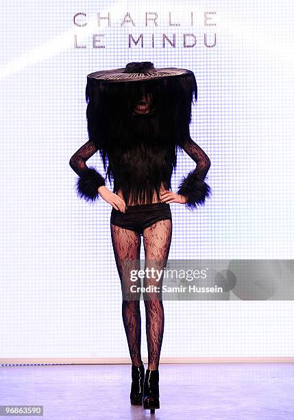 Model walks the catwalk during the Charlie Le Mindu Autumn/Winter London Fashion Week catwalk show at On|Off on February 19, 2010 in London, England.