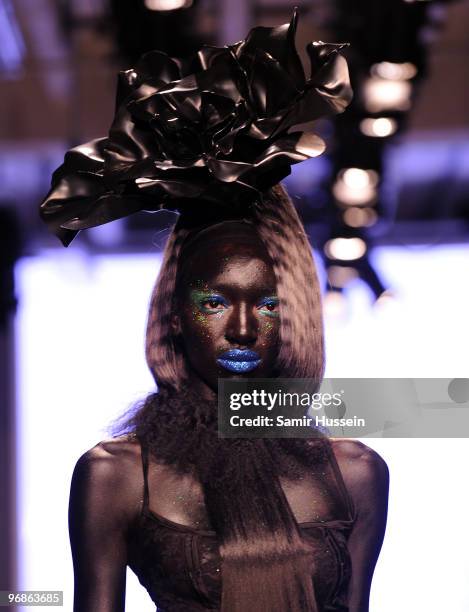 Model walks the catwalk during the Charlie Le Mindu Autumn/Winter London Fashion Week catwalk show at On|Off on February 19, 2010 in London, England.