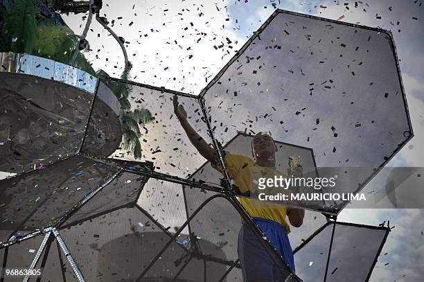 Former Brazilian national football team captain Cafu parades atop a float of Vai-Vai samba school at the Sambadrome as part of Carnival celebrations...