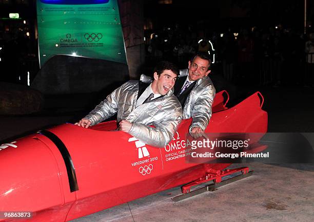 Olympic Gold Medalist Michael Phelps and President of OMEGA Stephen Urquhart attend the OMEGA Cocktail Celebration at the Fairmont Hotel on February...