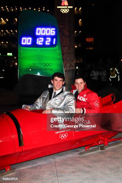 Olympic Gold Medalists Michael Phelps and Alexandre Bilodeau attend the OMEGA Cocktail Celebration at the Fairmont Hotel on February 18, 2010 in...
