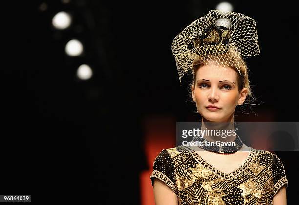 Model walks down the catwalk during the Caroline Charles fashion show during London Fashion Week at the BFC Show Space at Somerset House on February...