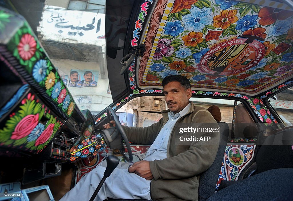 Pakistan Rafiullah Driver Asif Hussain, a Pakistani cab driver who has written a book, waits ...