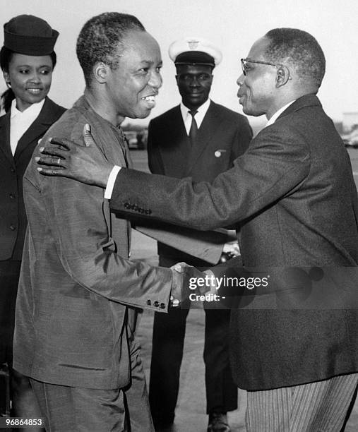 Tanzania's President Julius Nyerere is greeted 04 March 1968 by Senegalese counterpart Léopold Sédar Senghor prior his departure from Dakar after...