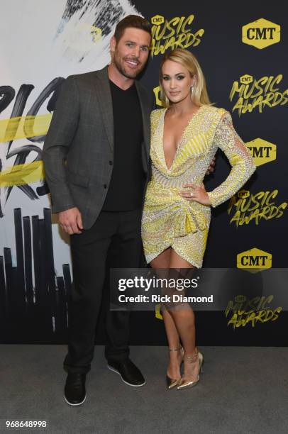 Mike Fisher and Carrie Underwood attend the 2018 CMT Music Awards at Bridgestone Arena on June 6, 2018 in Nashville, Tennessee.