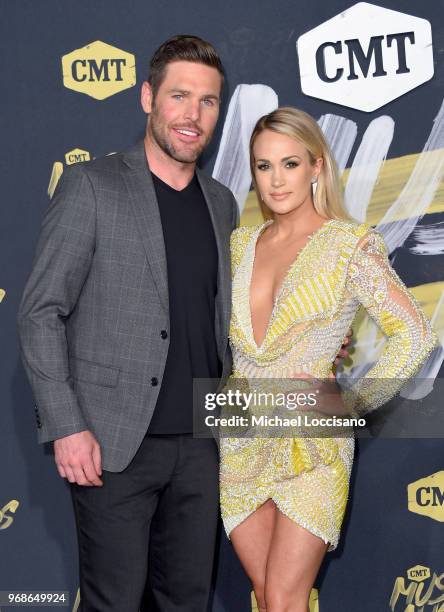 Mike Fisher and Carrie Underwood attend the 2018 CMT Music Awards at Bridgestone Arena on June 6, 2018 in Nashville, Tennessee.