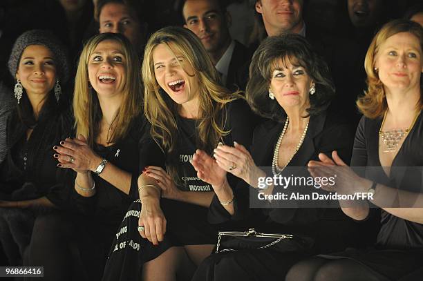 Journalist Celia Walden cheers on her boyfriend Piers Morgan while attending Naomi Campbell's Fashion For Relief Haiti London 2010 Fashion Show at...