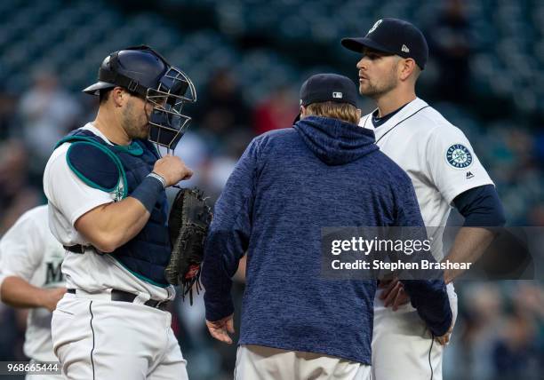 Catcher Mike Zunino of the Seattle Mariners, starting pitcher James Paxton of the Seattle Mariners and Seattle Mariners pitching coach Mel...