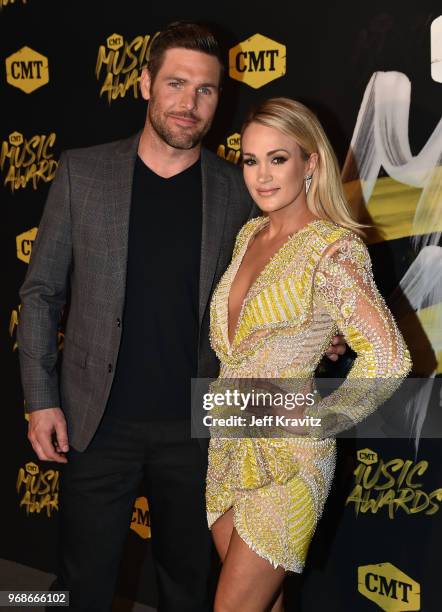 Mike Fisher and Carrie Underwood attend the 2018 CMT Music Awards at Bridgestone Arena on June 6, 2018 in Nashville, Tennessee.