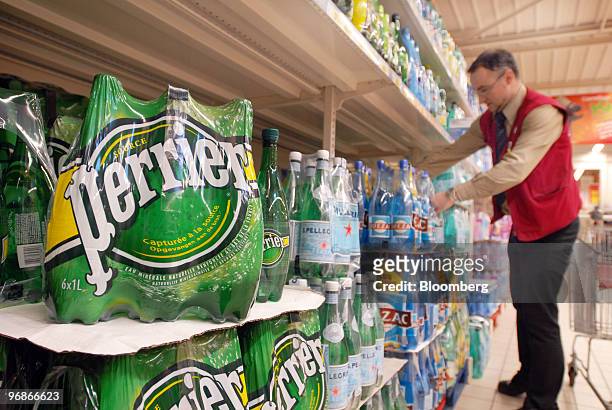 Bottles of Perrier water, produced by Nestle SA, are seen at a grocery store in Paris, France, on Friday, Feb. 19, 2010. Nestle, the bottler of...