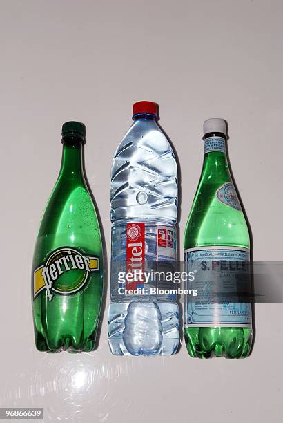 Bottles of Perrier, Vittel, and San Pellegrino water, produced by Nestle SA, are seen arranged for a photograph in Paris, France, on Friday, Feb. 19,...