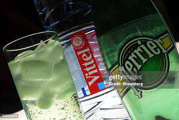 Bottles of Vittel and Perrier water, produced by Nestle SA, are seen arranged for a photograph in Paris, France, on Friday, Feb. 19, 2010. Nestle,...