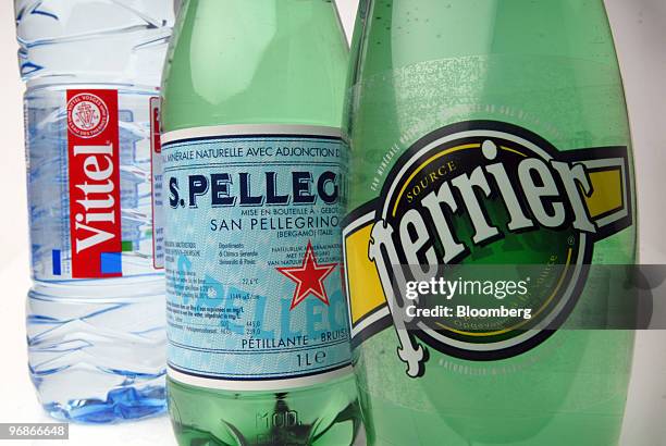 Bottles of Vittel, San Pellegrino, and Perrier water, produced by Nestle SA, are seen arranged for a photograph in Paris, France, on Friday, Feb. 19,...