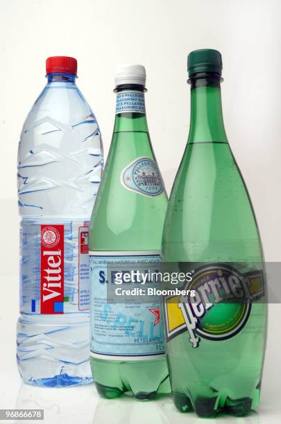 Bottles of Vittel, San Pellegrino, and Perrier water, produced by Nestle SA, are seen arranged for a photograph in Paris, France, on Friday, Feb. 19,...