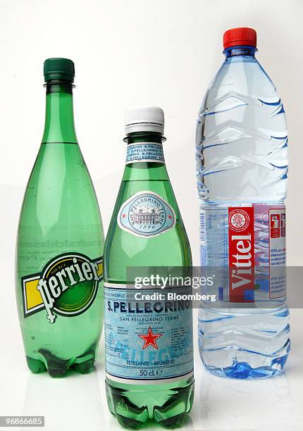 Bottles of Perrier, San Pellegrino, and Vittel water, produced by Nestle SA, are seen arranged for a photograph in Paris, France, on Friday, Feb. 19,...