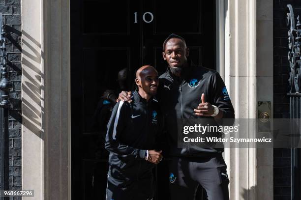 Olympic champions Sir Mo Farah and Usain Bolt pose outside 10 Downing Street in central London before a reception hosted by Prime Minister Theresa...