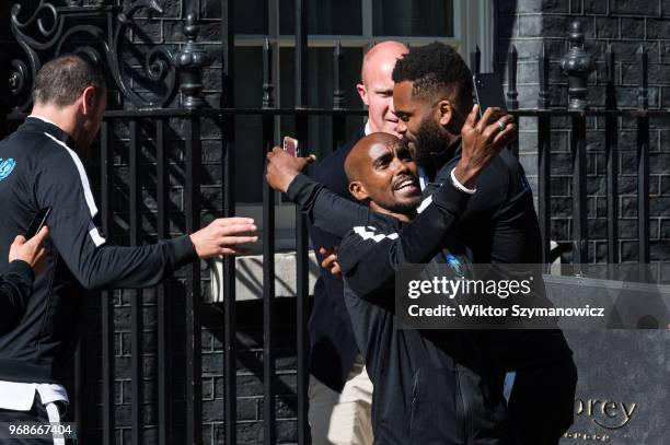 Olympic champion Sir Mo Farah takes a selfie outside 10 Downing Street in central London before a reception hosted by Prime Minister Theresa May for...