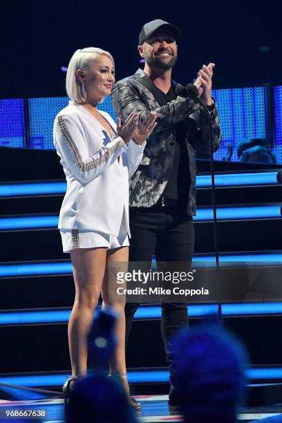 RaeLynn and Cody Alan speak onstage during 2018 CMT Music Awards at Bridgestone Arena on June 6, 2018 in Nashville, Tennessee.