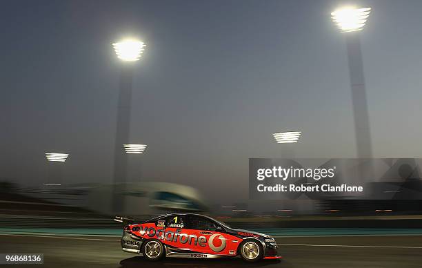 Jamie Whincup drives the Vodafone Holden during race one for round one of the V8 Supercar Championship Series at Yas Marina Circuit on February 19,...